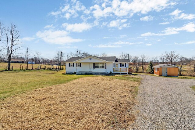 view of front of home with covered porch and a front lawn