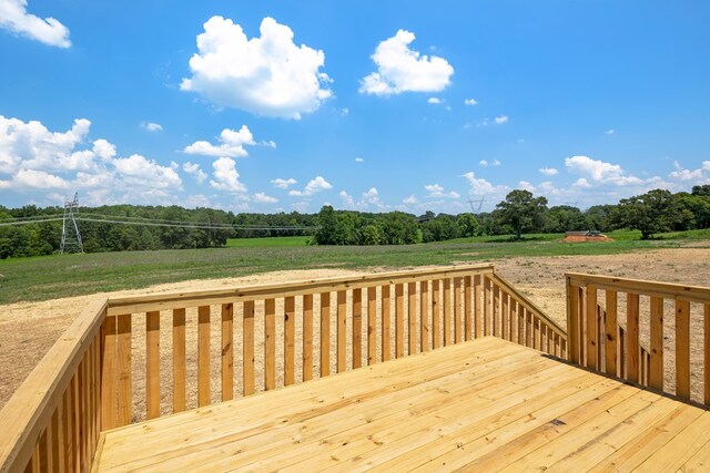 wooden terrace with a rural view