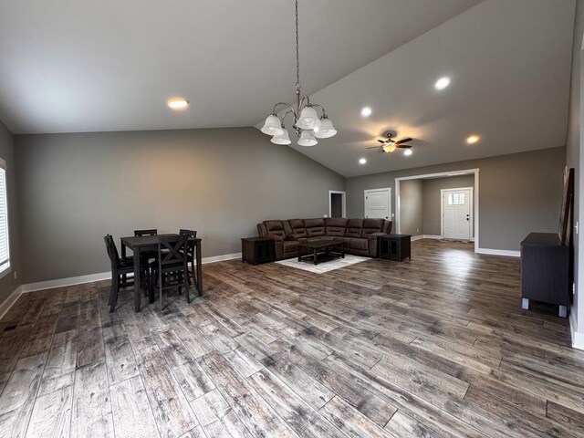 living area featuring recessed lighting, baseboards, wood finished floors, vaulted ceiling, and ceiling fan with notable chandelier