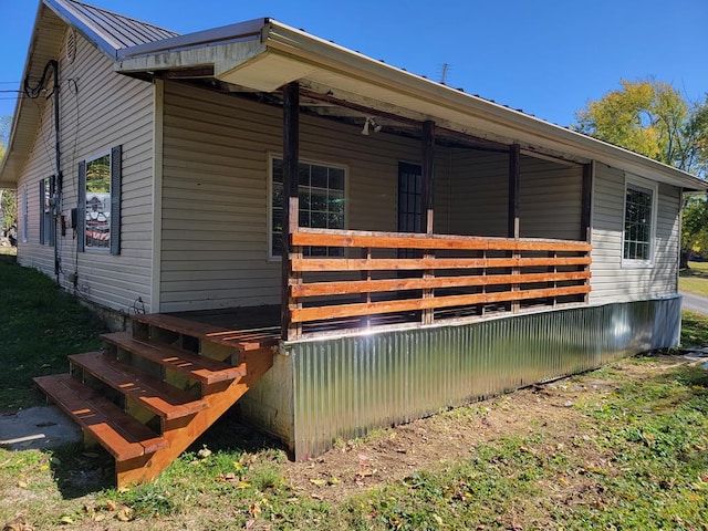 exterior space featuring a standing seam roof and metal roof