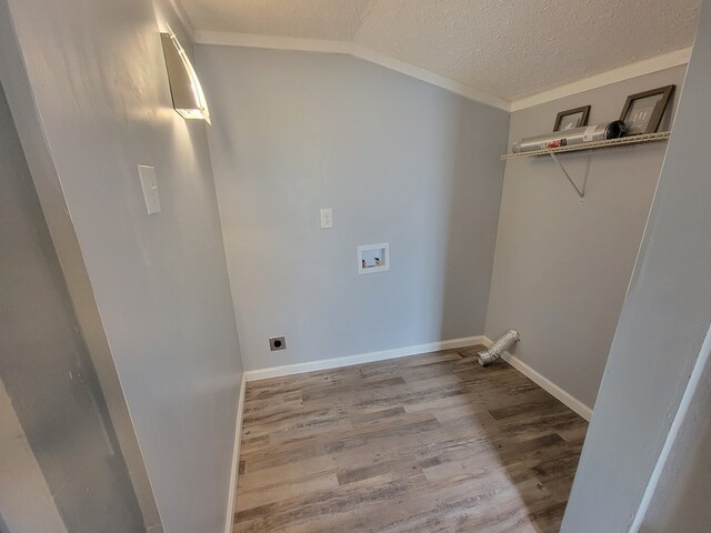 washroom featuring washer hookup, hookup for an electric dryer, a textured ceiling, wood finished floors, and laundry area