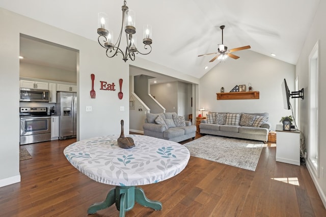 dining room featuring lofted ceiling, stairway, dark wood finished floors, and ceiling fan with notable chandelier