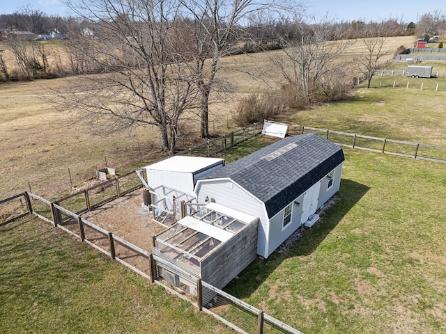 birds eye view of property with a rural view