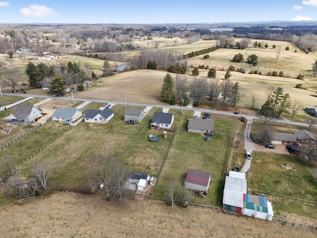 birds eye view of property with a rural view