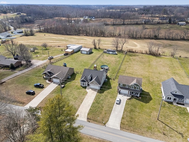 birds eye view of property with a rural view