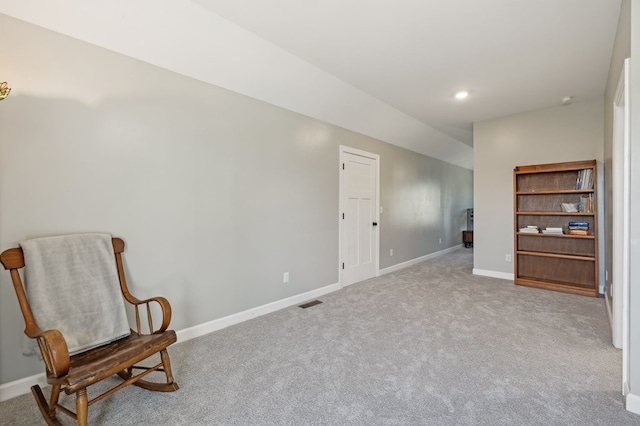 living area featuring carpet floors, recessed lighting, visible vents, and baseboards