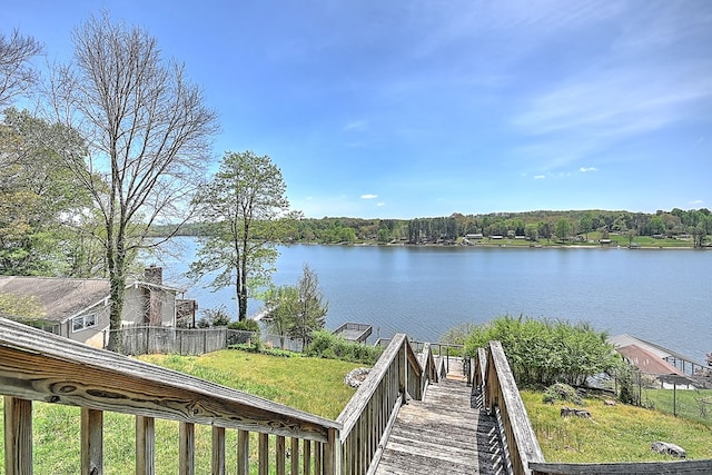 view of water feature with fence