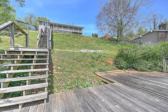 view of yard featuring a deck and stairway