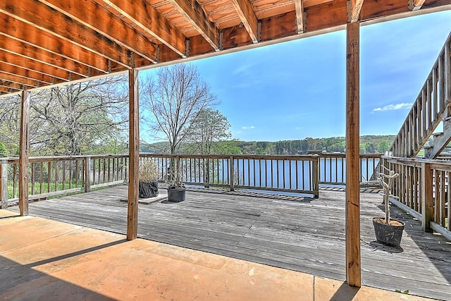 wooden deck featuring a water view