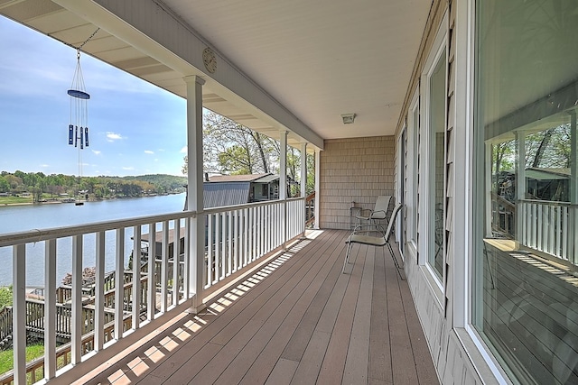 wooden deck with a water view