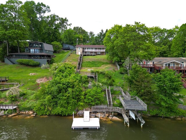 exterior space with stairway and a water view