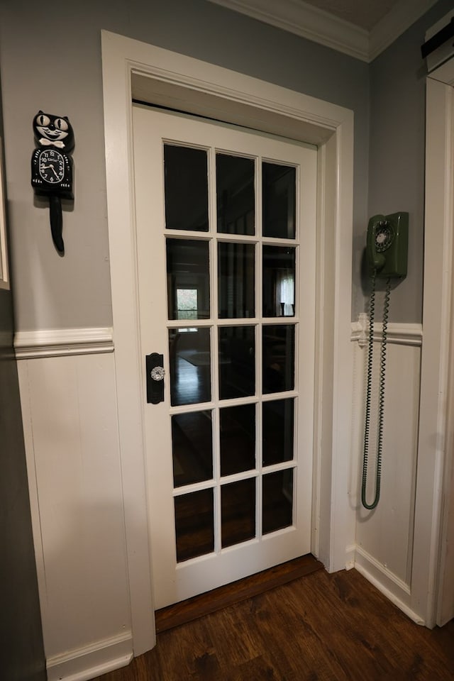 interior space with crown molding and dark wood finished floors