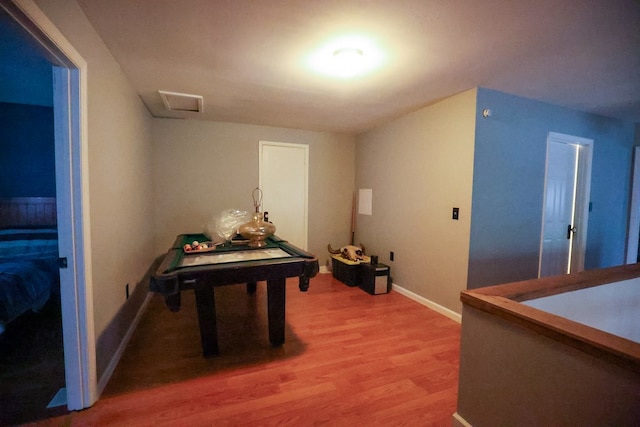 game room with visible vents, baseboards, and wood finished floors