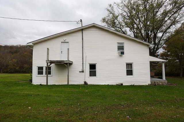 view of side of property with a lawn