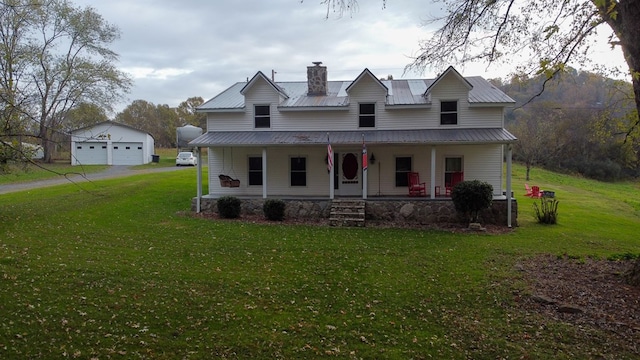 view of front of home with a porch, a front yard, metal roof, and a chimney