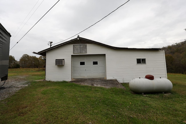 detached garage featuring driveway