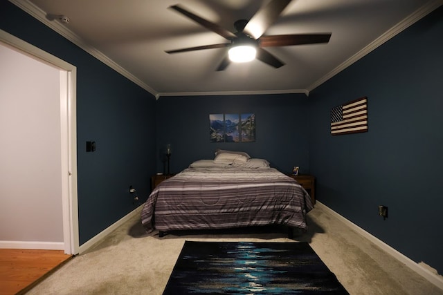 bedroom featuring baseboards, ornamental molding, and carpet flooring