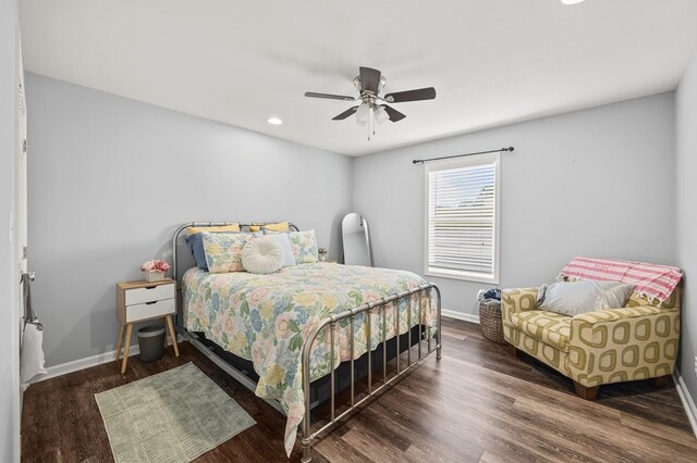 bedroom with a ceiling fan, recessed lighting, dark wood finished floors, and baseboards