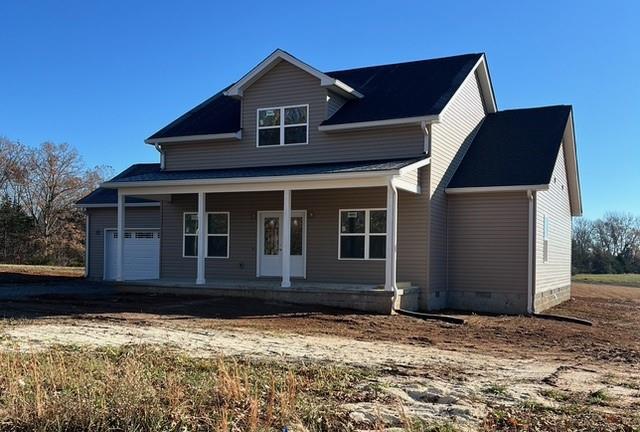 view of front of property featuring a porch, crawl space, and an attached garage