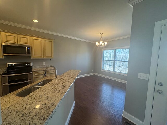 kitchen featuring light stone counters, a sink, dark wood-type flooring, appliances with stainless steel finishes, and crown molding