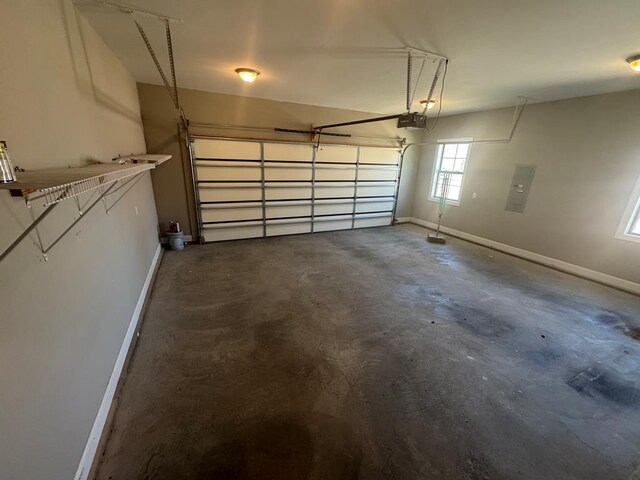 garage featuring baseboards and a garage door opener