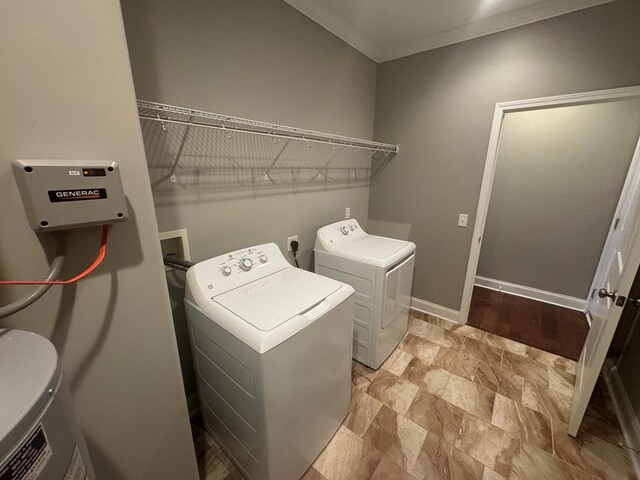 laundry room with laundry area, crown molding, separate washer and dryer, and baseboards