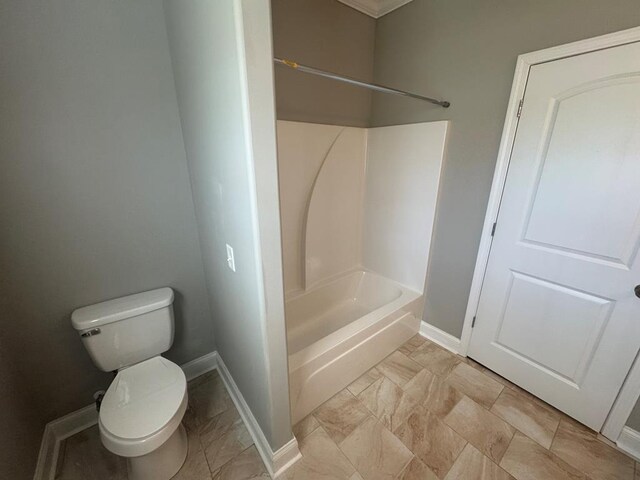 bathroom with toilet, wood finished floors, and baseboards