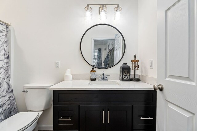 bathroom with vanity and toilet