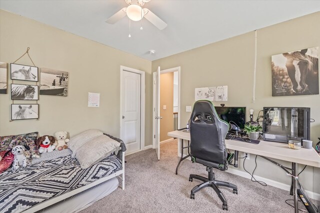 bedroom featuring baseboards, ceiling fan, and light colored carpet