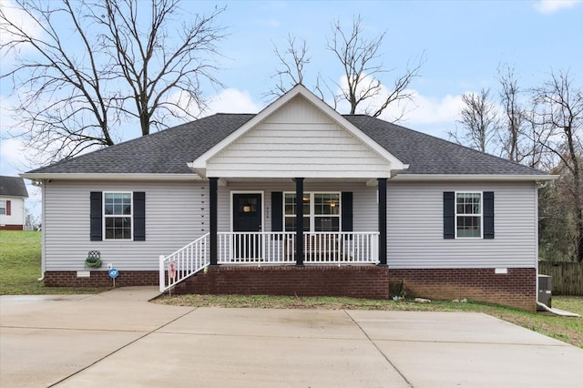 view of front of property with crawl space, a porch, central AC, and roof with shingles