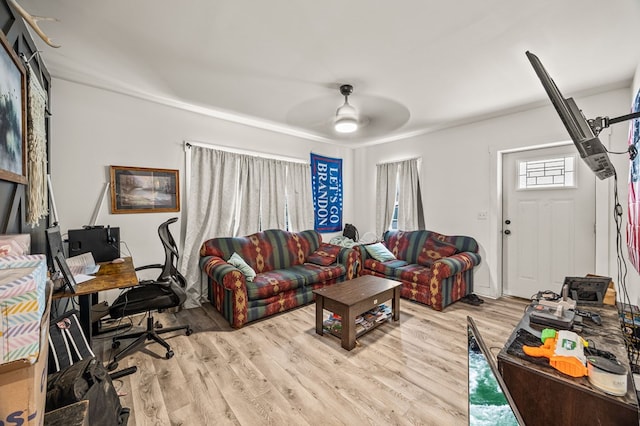 living room featuring ceiling fan and light wood finished floors