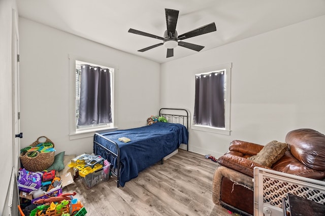 bedroom featuring ceiling fan and wood finished floors