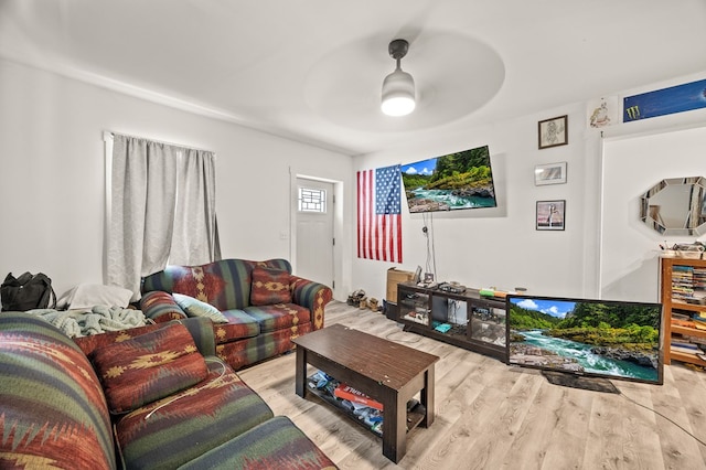 living room featuring light wood-type flooring and ceiling fan