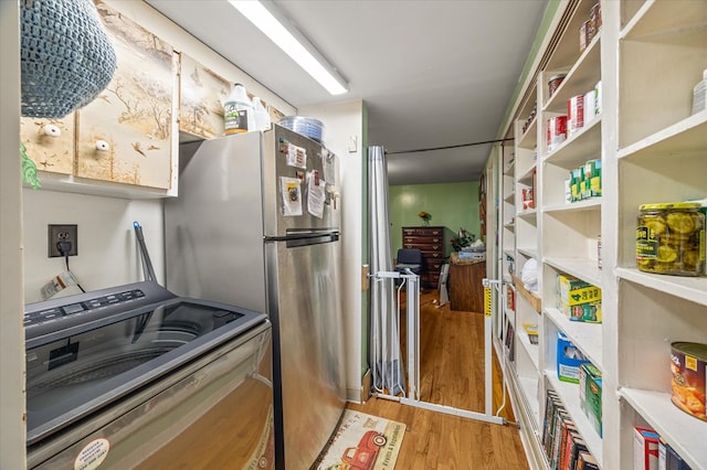 kitchen with light wood-style flooring and stove