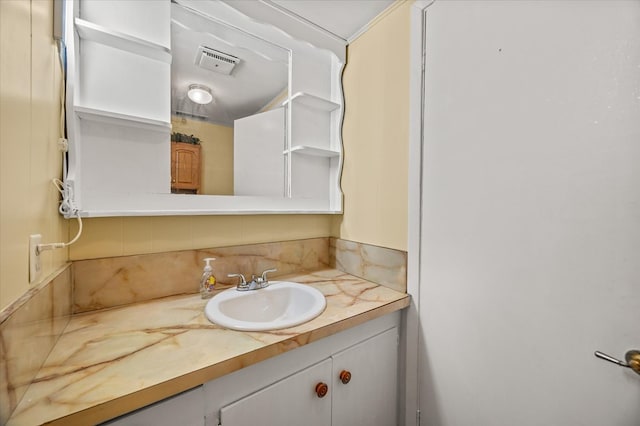 bathroom with visible vents and vanity