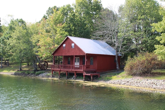 rear view of property featuring a water view