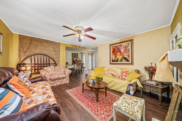 living room featuring crown molding, ceiling fan, and wood finished floors