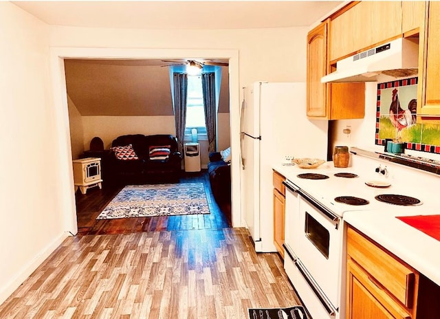 kitchen with white appliances, baseboards, light countertops, under cabinet range hood, and light wood-type flooring