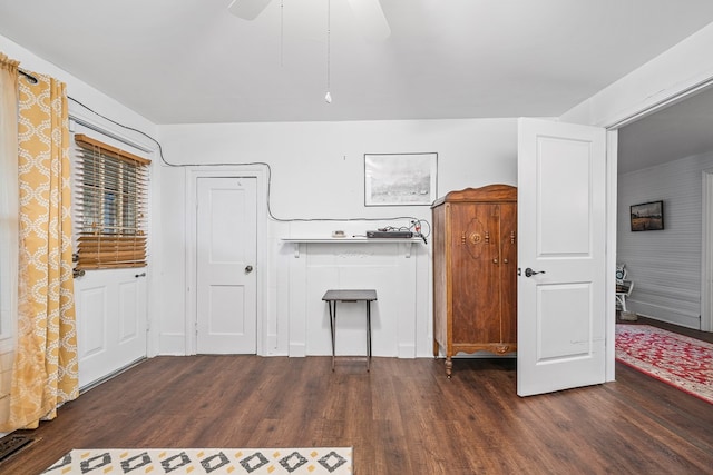 interior space with ceiling fan and wood finished floors