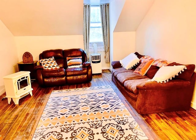 living area with hardwood / wood-style floors and vaulted ceiling