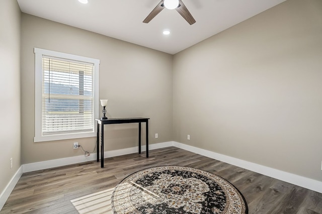 unfurnished room with recessed lighting, baseboards, wood finished floors, and a ceiling fan