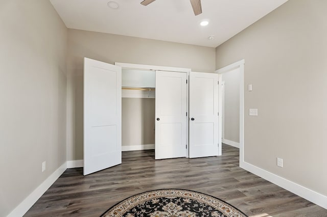 unfurnished bedroom with dark wood-type flooring, a ceiling fan, recessed lighting, a closet, and baseboards