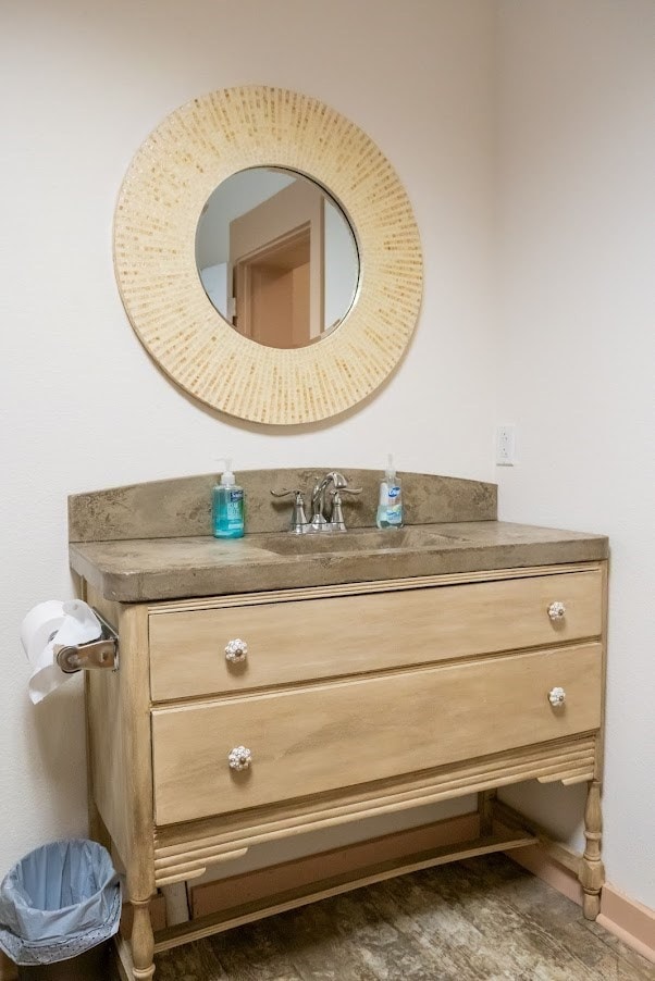 bathroom featuring baseboards and vanity