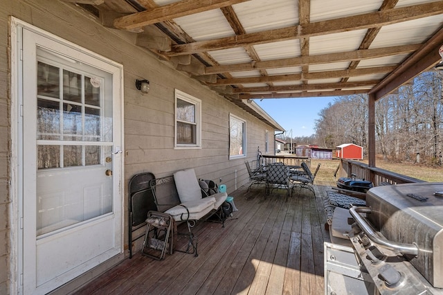 wooden terrace with outdoor dining area