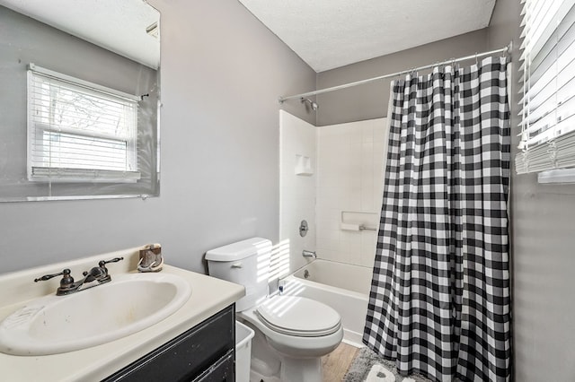 bathroom featuring shower / tub combo with curtain, toilet, a textured ceiling, vanity, and wood finished floors