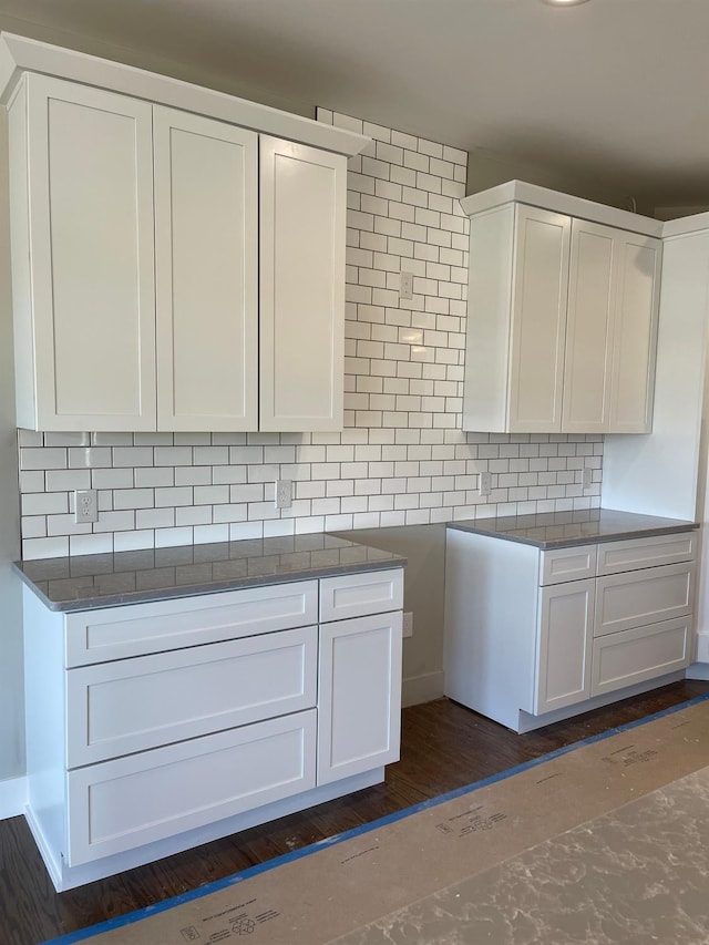 4224 Duck Dr Unit 5, Ann Arbor, MI 48103 - kitchen featuring decorative backsplash and white cabinetry