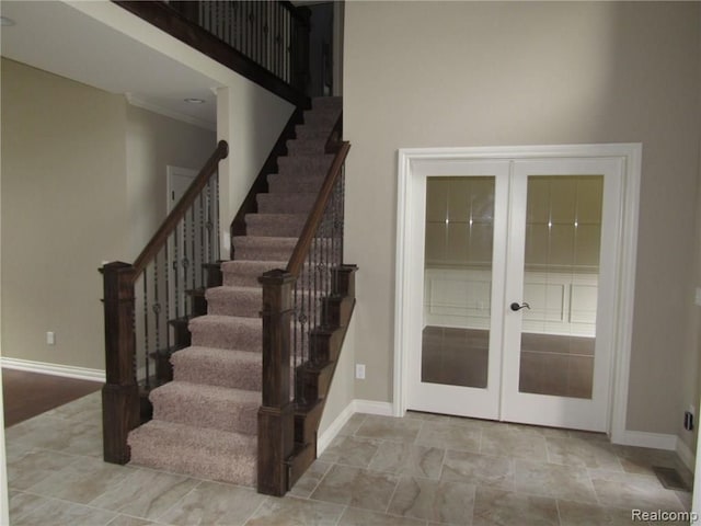 staircase with french doors