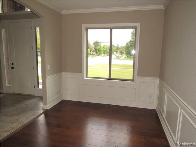 entryway featuring dark hardwood / wood-style floors and ornamental molding