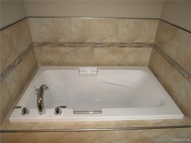 bathroom featuring tiled bath