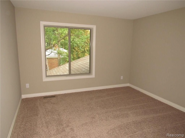 view of carpeted spare room